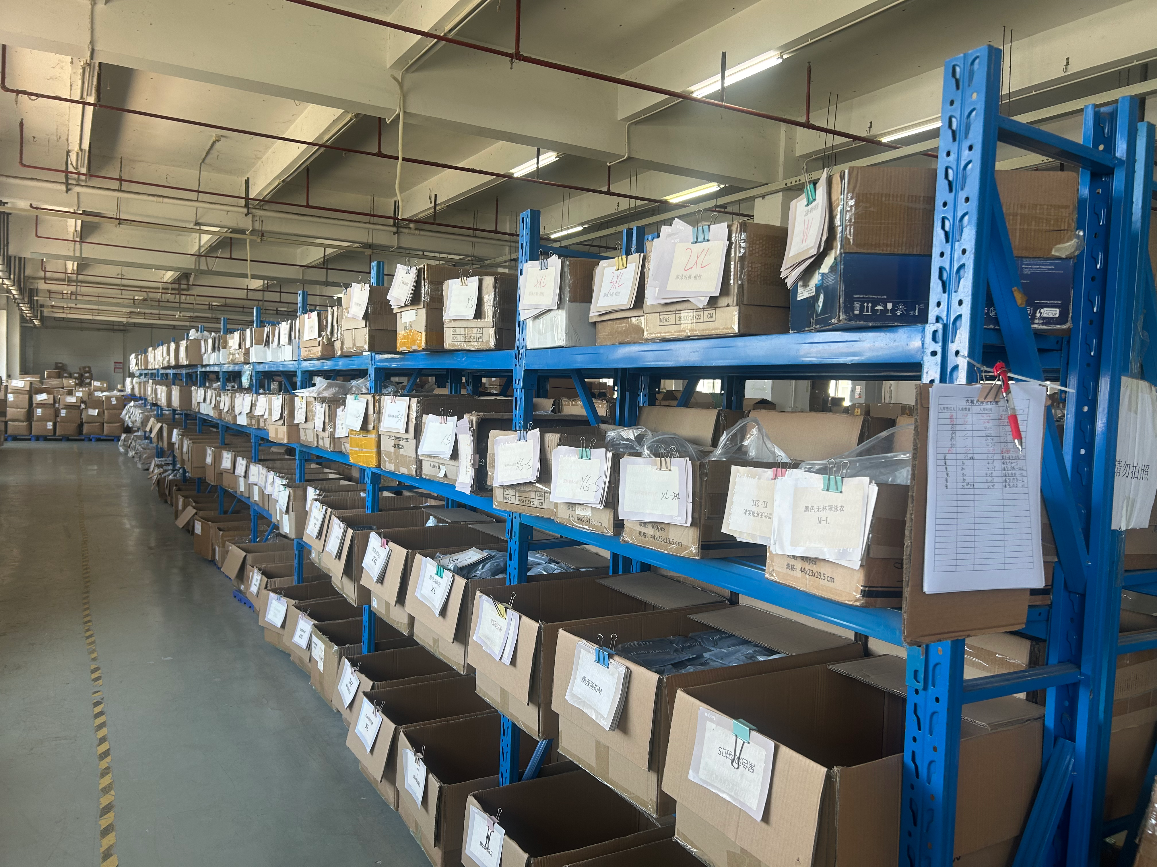 Ecomfulfill warehouse with shelving organized for clothes fulfillment